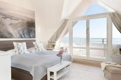 Ein Bett oder Betten in einem Zimmer der Unterkunft Strandburg Strandperle Scharbeutz