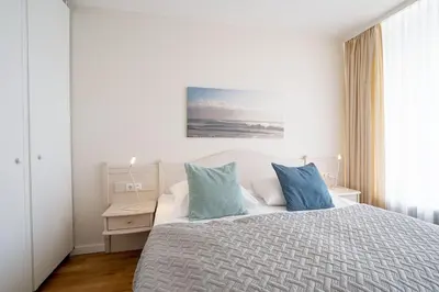 Ein Bett oder Betten in einem Zimmer der Unterkunft Haus Meeresstrand Buddelschiff