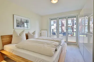 Ein Bett oder Betten in einem Zimmer der Unterkunft Strandduene Stranddüne Appartement 3