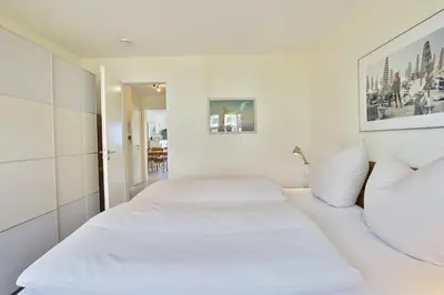 Ein Bett oder Betten in einem Zimmer der Unterkunft Strandduene Stranddüne Appartement 3