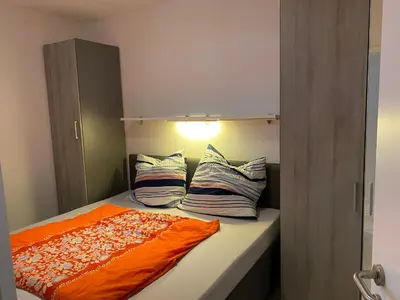 Ein Bett oder Betten in einem Zimmer der Unterkunft Berliner Hof 3-Zi-Wohnung mit Meerblick und Strandlage an der Promenade
