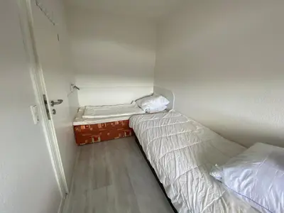 Ein Bett oder Betten in einem Zimmer der Unterkunft Berliner Hof 3-Zi-Wohnung mit Meerblick und Strandlage an der Promenade