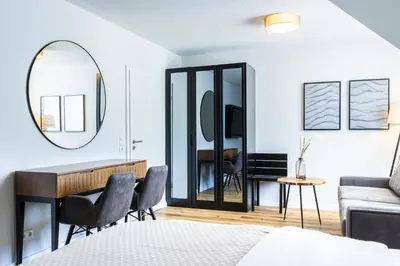 Ein Bett oder Betten in einem Zimmer der Unterkunft Moderne Ferienunterkunft in ruhiger Lage und nur 7 Gehminuten vom Strand entfernt - hoher Schlafkomfort und Gartenzugang für die ideale Erholung an der Ostsee