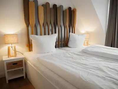 Ein Bett oder Betten in einem Zimmer der Unterkunft App Ostseebrise
