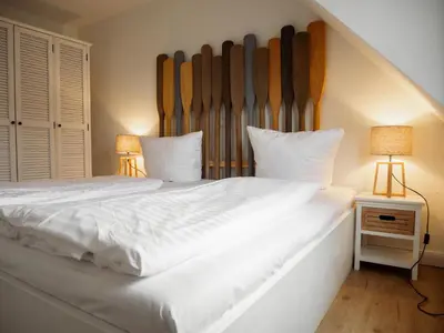 Ein Bett oder Betten in einem Zimmer der Unterkunft App Ostseebrise