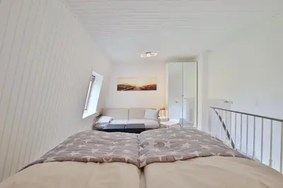 Ein Bett oder Betten in einem Zimmer der Unterkunft Haus Miramar TREF Appartement 40 Meeresrauschen