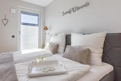 Ein Bett oder Betten in einem Zimmer der Unterkunft BLACK PEARL Penthouse Black Pearl