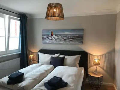 Ein Bett oder Betten in einem Zimmer der Unterkunft Alte Glaserei Travemünde