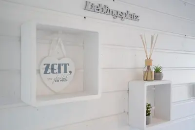 Ein Zertifikat, Auszeichnung, Logo oder anderes Dokument, das in der Unterkunft Ostseecamp Lübecker Bucht Ferienhaus 