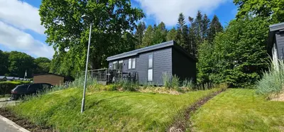 Ein Garten an der Unterkunft Ostseecamp Lübecker Bucht Ferienhaus 