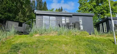 Ein Garten an der Unterkunft Ostseecamp Lübecker Bucht Ferienhaus 