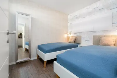 Ein Bett oder Betten in einem Zimmer der Unterkunft Ferienpark Sierksdorf App 111 - Strandlage