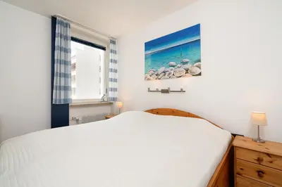 Ein Bett oder Betten in einem Zimmer der Unterkunft Ferienpark Sierksdorf App 299 - Strandlage