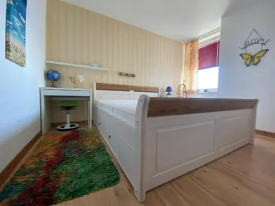 Ein Bett oder Betten in einem Zimmer der Unterkunft Ferienpark Sierksdorf App 448 - Strandlage