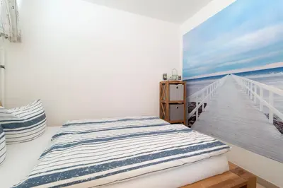 Ein Bett oder Betten in einem Zimmer der Unterkunft Ferienpark Sierksdorf App 449 - Strandlage