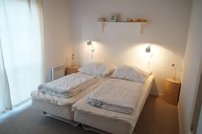 Ein Bett oder Betten in einem Zimmer der Unterkunft Strandpark Sierksdorf H073