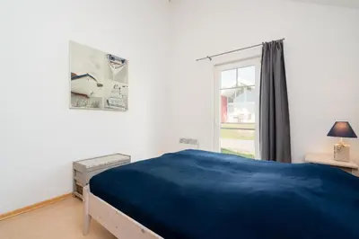 Ein Bett oder Betten in einem Zimmer der Unterkunft Strandpark Sierksdorf H087