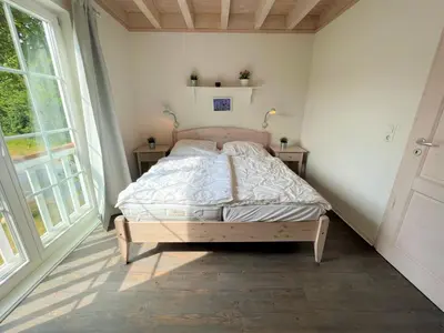 Ein Bett oder Betten in einem Zimmer der Unterkunft Strandpark Sierksdorf H080