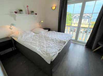 Ein Bett oder Betten in einem Zimmer der Unterkunft Strandpark Sierksdorf H080