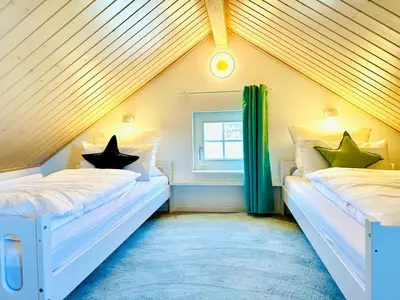 Ein Bett oder Betten in einem Zimmer der Unterkunft Strandpark Sierksdorf H009