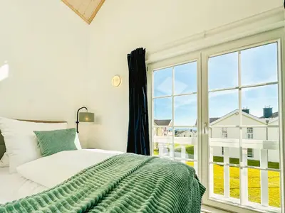 Ein Bett oder Betten in einem Zimmer der Unterkunft Strandpark Sierksdorf H009