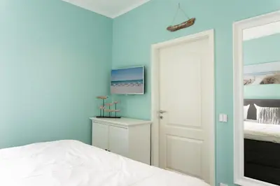 Ein Bett oder Betten in einem Zimmer der Unterkunft Ferienpark Sierksdorf App 827 - Penthouse