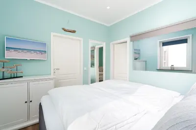 Ein Bett oder Betten in einem Zimmer der Unterkunft Ferienpark Sierksdorf App 827 - Penthouse