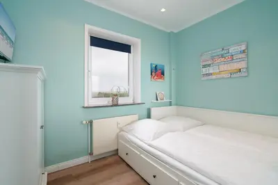 Ein Bett oder Betten in einem Zimmer der Unterkunft Ferienpark Sierksdorf App 827 - Penthouse