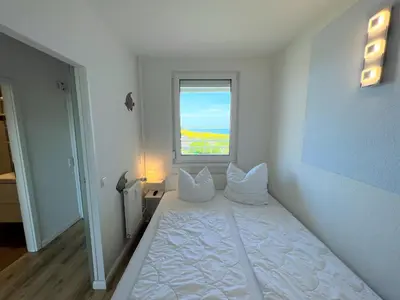 Ein Bett oder Betten in einem Zimmer der Unterkunft Ferienpark Sierksdorf App 782 - Strandlage