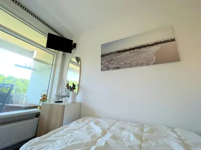 Ein Bett oder Betten in einem Zimmer der Unterkunft Panoramic App A03-1