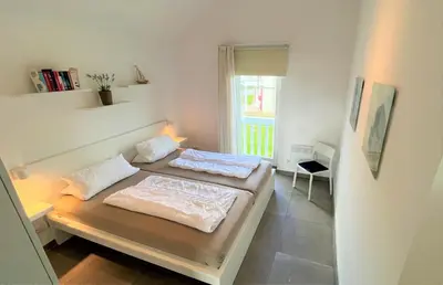 Ein Bett oder Betten in einem Zimmer der Unterkunft Strandpark Sierksdorf H066
