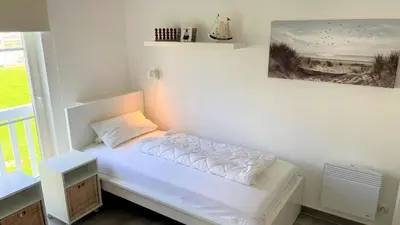 Ein Bett oder Betten in einem Zimmer der Unterkunft Strandpark Sierksdorf H066