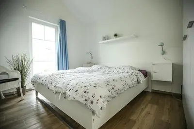 Ein Bett oder Betten in einem Zimmer der Unterkunft Strandpark Sierksdorf H081