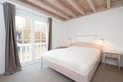Ein Bett oder Betten in einem Zimmer der Unterkunft Strandpark Sierksdorf H056