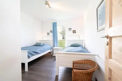 Ein Bett oder Betten in einem Zimmer der Unterkunft Strandpark Sierksdorf H064