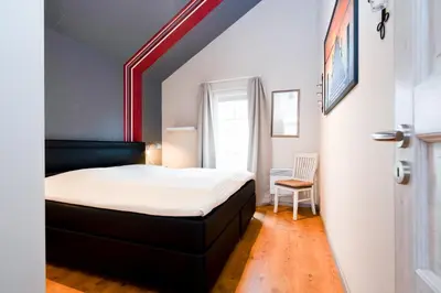 Ein Bett oder Betten in einem Zimmer der Unterkunft Strandpark Sierksdorf H072