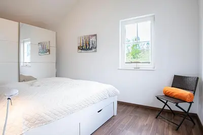 Ein Bett oder Betten in einem Zimmer der Unterkunft Strandpark Sierksdorf H048
