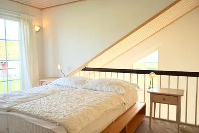 Ein Bett oder Betten in einem Zimmer der Unterkunft Strandpark Sierksdorf H100