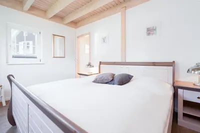 Ein Bett oder Betten in einem Zimmer der Unterkunft Strandpark Sierksdorf H094