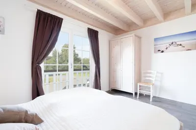 Ein Bett oder Betten in einem Zimmer der Unterkunft Strandpark Sierksdorf H094