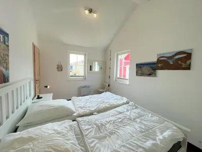 Ein Bett oder Betten in einem Zimmer der Unterkunft Strandpark Sierksdorf H049