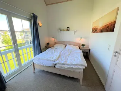 Ein Bett oder Betten in einem Zimmer der Unterkunft Strandpark Sierksdorf H008