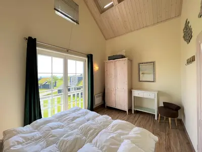 Ein Bett oder Betten in einem Zimmer der Unterkunft Strandpark Sierksdorf H092 