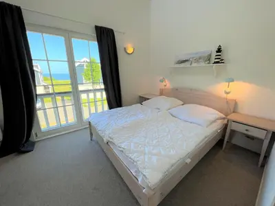 Ein Bett oder Betten in einem Zimmer der Unterkunft Strandpark Sierksdorf H079