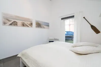 Ein Bett oder Betten in einem Zimmer der Unterkunft Strandpark Sierksdorf H057