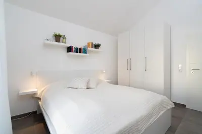 Ein Bett oder Betten in einem Zimmer der Unterkunft Strandpark Sierksdorf H057
