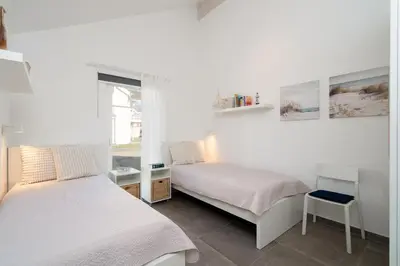 Ein Bett oder Betten in einem Zimmer der Unterkunft Strandpark Sierksdorf H057