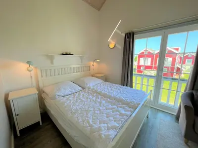 Ein Bett oder Betten in einem Zimmer der Unterkunft Strandpark Sierksdorf H054