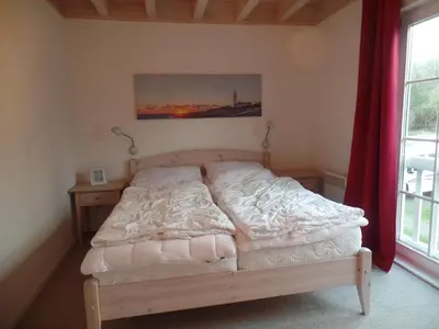 Ein Bett oder Betten in einem Zimmer der Unterkunft Strandpark Sierksdorf H010