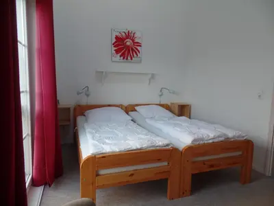 Ein Bett oder Betten in einem Zimmer der Unterkunft Strandpark Sierksdorf H010